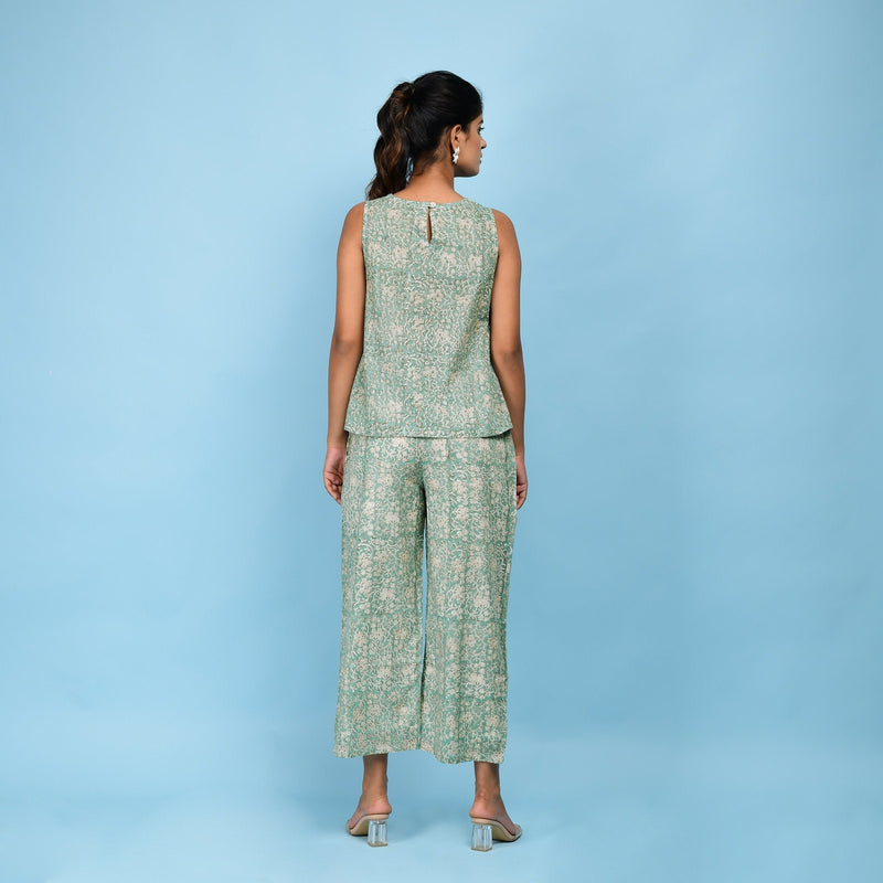 Back View of a Model wearing Sage Green Block Printed Pleated Cotton Top