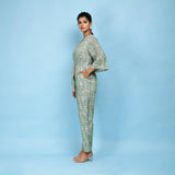 Left View of a Model wearing Sage Green Block Printed Ankle Length Cotton Jumpsuit