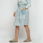 Left View of a Model wearing Sage Green Block Printed Cotton Knee Length Skirt