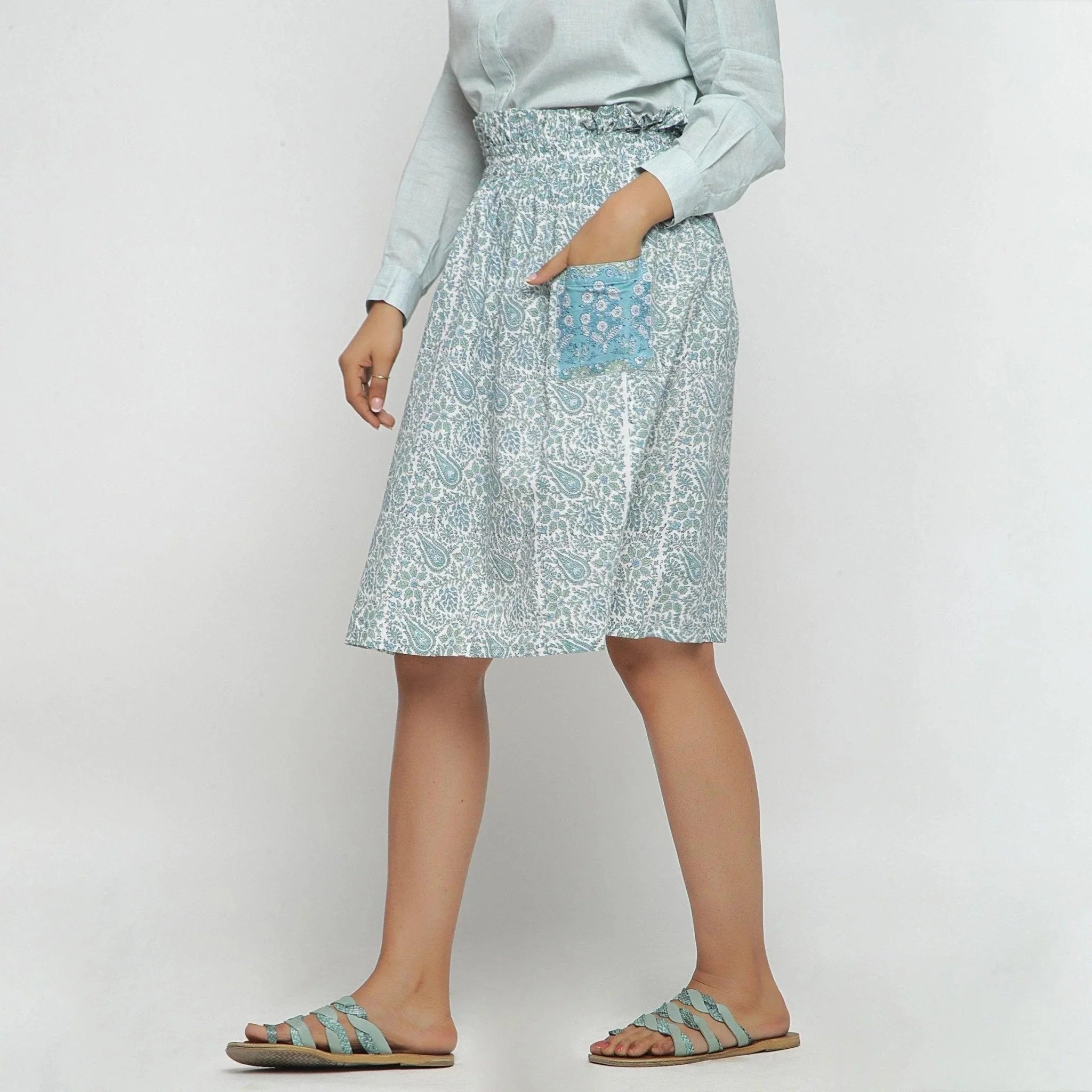 Left View of a Model wearing Sage Green Block Printed Cotton Knee Length Skirt