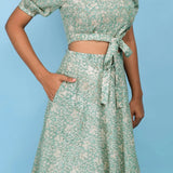 Front Detail of a Model wearing Sage Green Block Printed 100% Cotton High-Low Circular Skirt