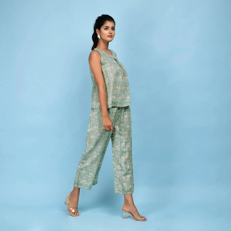 Right View of a Model wearing Sage Green Block Printed Pleated Cotton Top