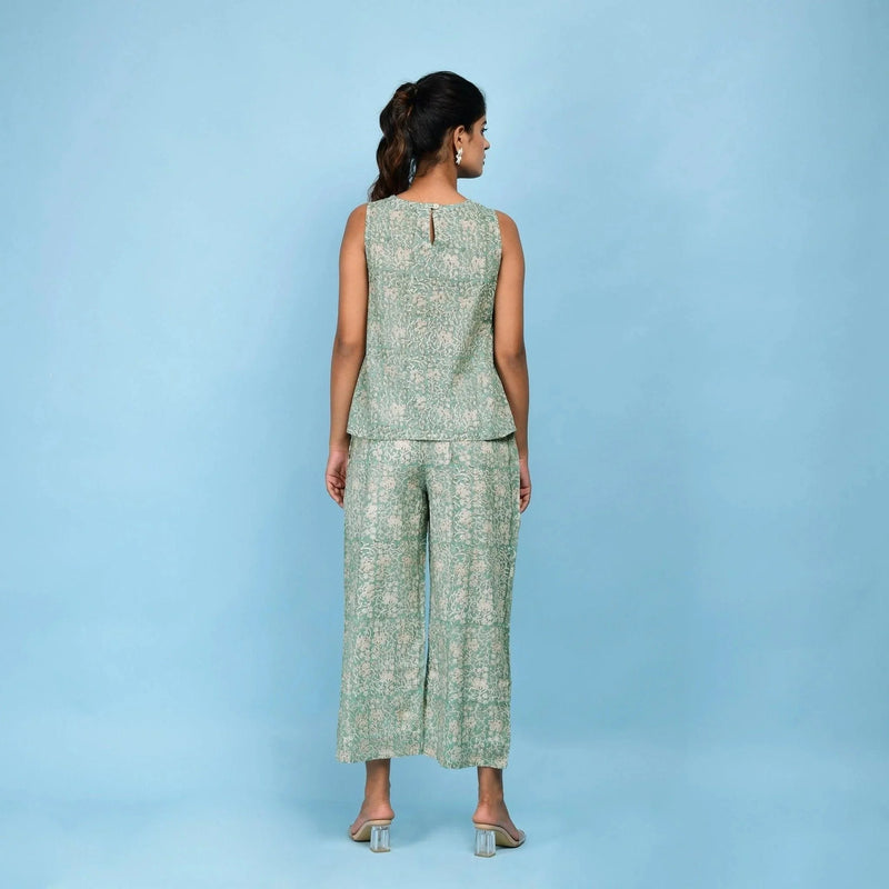 Back View of a Model wearing Sage Green Block Printed Pleated Cotton Top