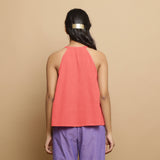 Back View of a Model wearing Salmon Pink Hand-Embroidered Halter Neck Top