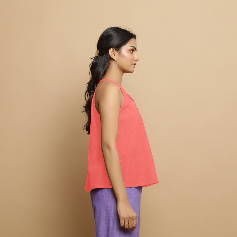 Right View of a Model wearing Salmon Pink Hand-Embroidered Halter Neck Top