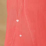 Close View of a Model wearing Salmon Pink Hand-Embroidered Halter Neck Top