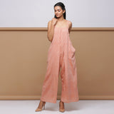 Front View of Model wearing Salmon Pink Handspun Pleated Jumpsuit