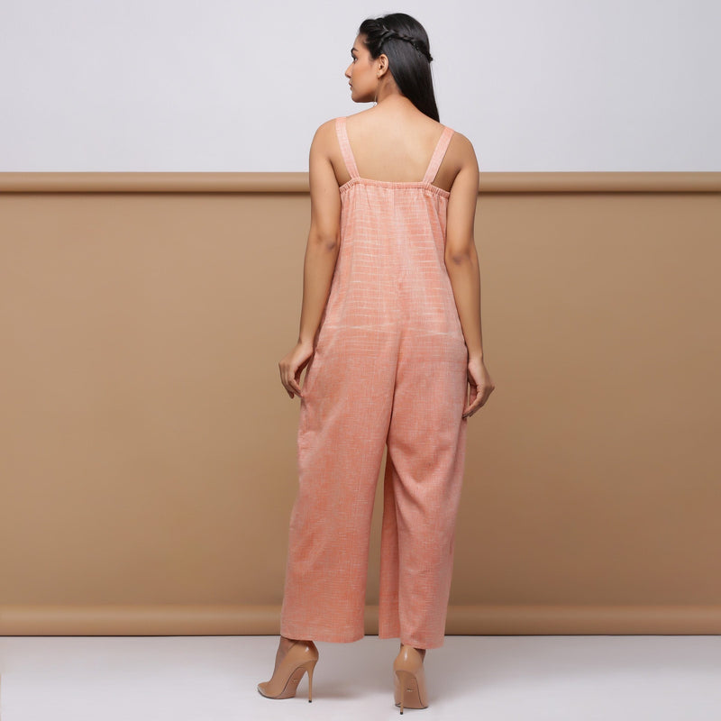 Back View of Model wearing Salmon Pink Handspun Pleated Jumpsuit