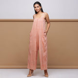 Front View of Model wearing Salmon Pink Handspun Pleated Jumpsuit