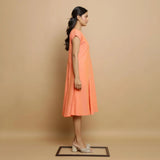 Right View of a Model wearing Salmon Pink Mangalgiri Cotton Button-Down Midi Dress