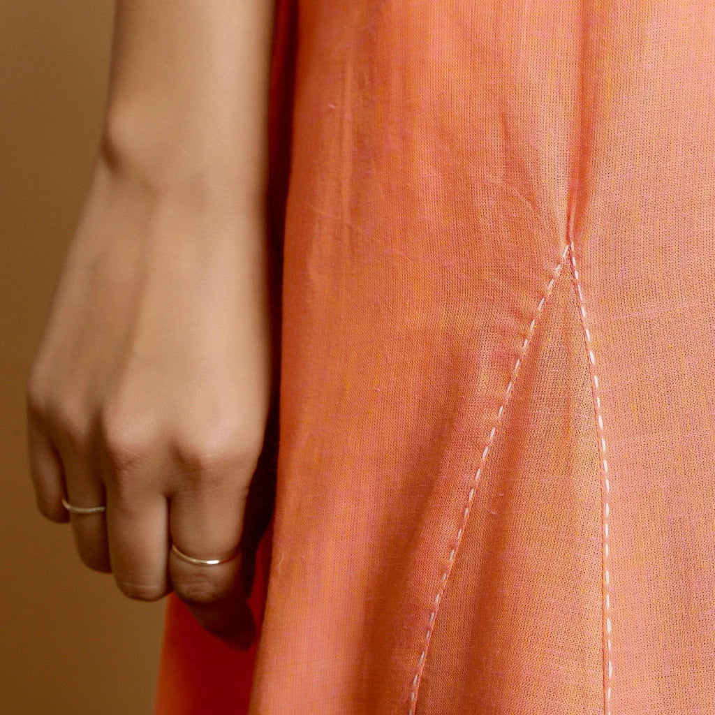 Close View of a Model wearing Salmon Pink Mangalgiri Cotton Godet Maxi Dress