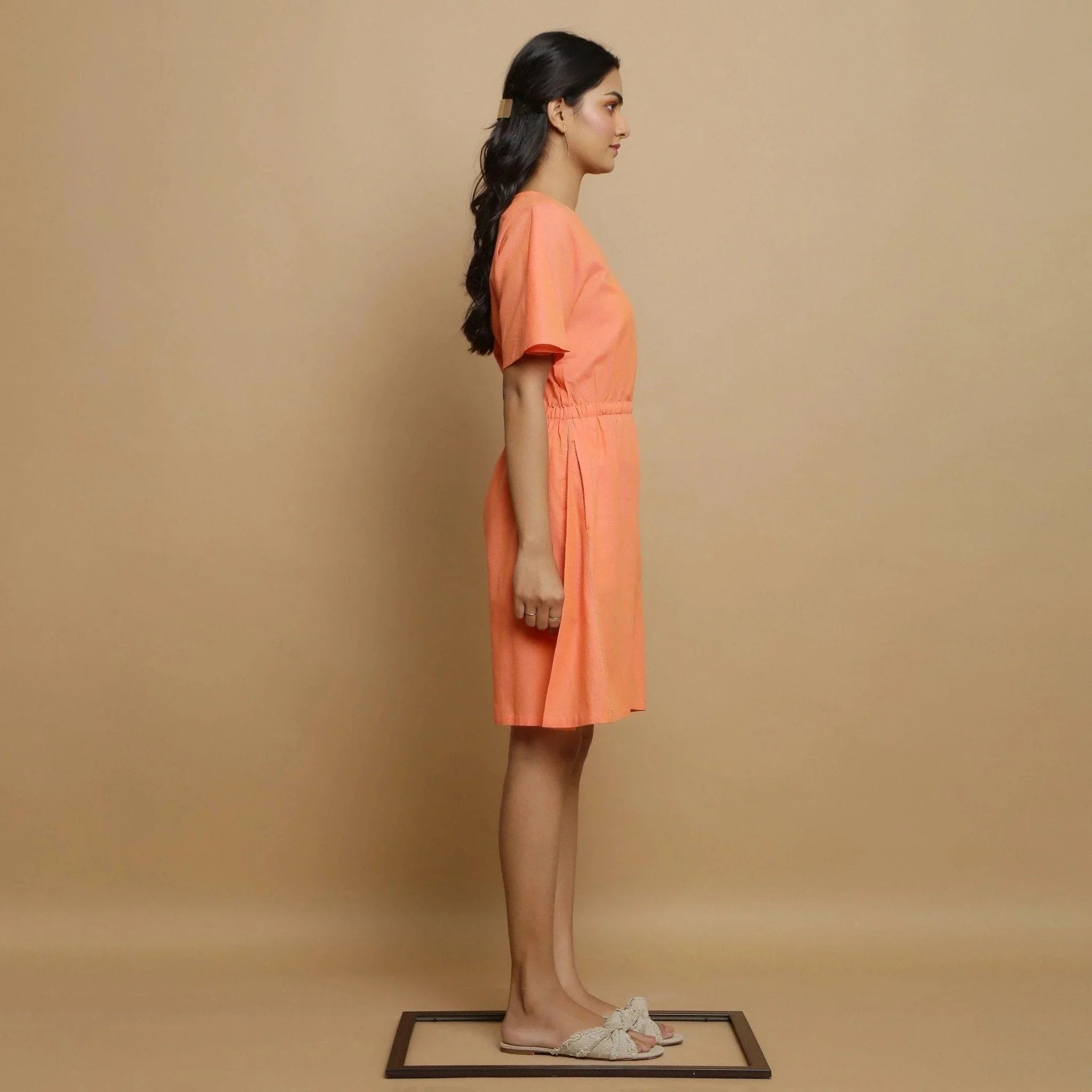 Right View of a Model wearing Salmon Pink Button-Down Godet Jumpsuit