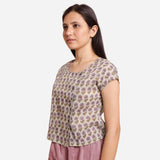 Left View of a Model wearing Sanganeri Print Short Asymmetric Blouse