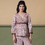 Front View of a Model wearing Sangria Wine Shibori Tie-Dye Cotton Wrap Top