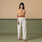 Front View of a Model wearing Shibori Button-Down Blouson Top