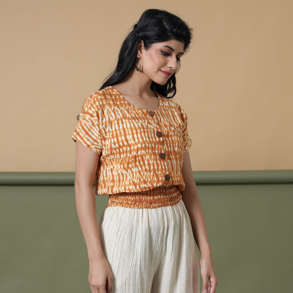 Right View of a Model wearing Shibori Button-Down Blouson Top