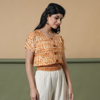 Right View of a Model wearing Shibori Button-Down Blouson Top