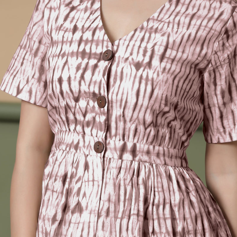 Front Detail of a Model wearing Shibori Button-Down Maroon Peplum Top