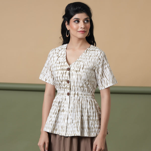 Front View of a Model wearing Shibori Button-Down Peplum Top