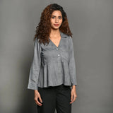 Front View of a Model wearing Slate Grey Handspun 100% Cotton Flat Collar Peplum Top