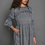 Front Detail of a Model wearing Slate Grey Handspun Cotton Knee Length Frilled Peasant Dress