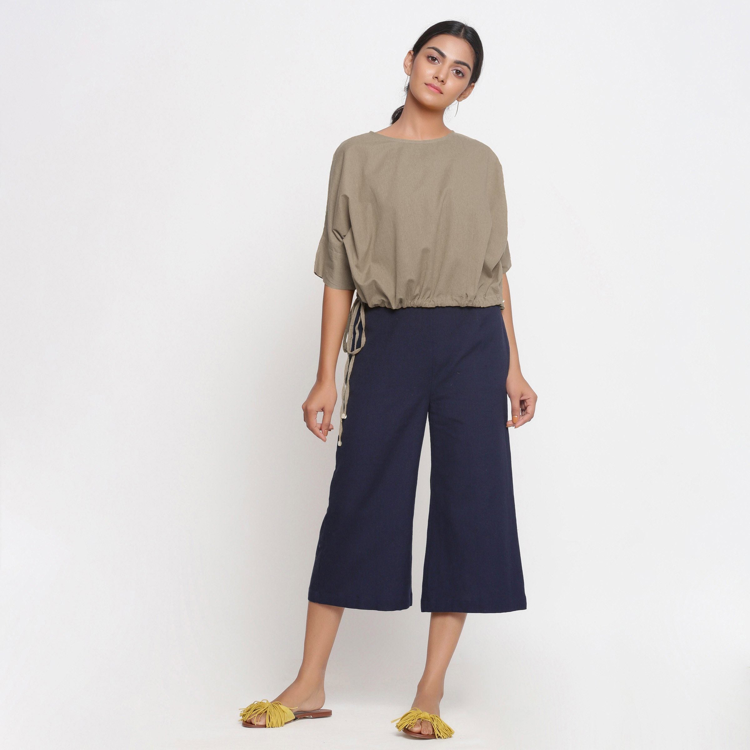 Front View of a Model wearing Solid Beige Cotton Flax Blouson Top