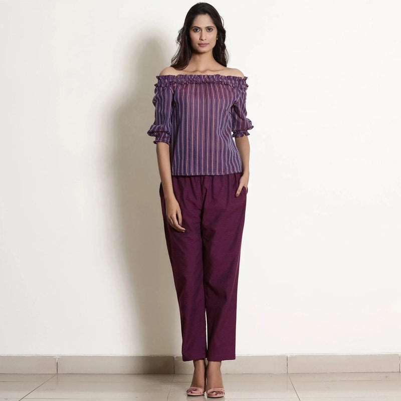 Front View of a Model wearing Solid Berry Wine Warm Cotton Tapered Pant