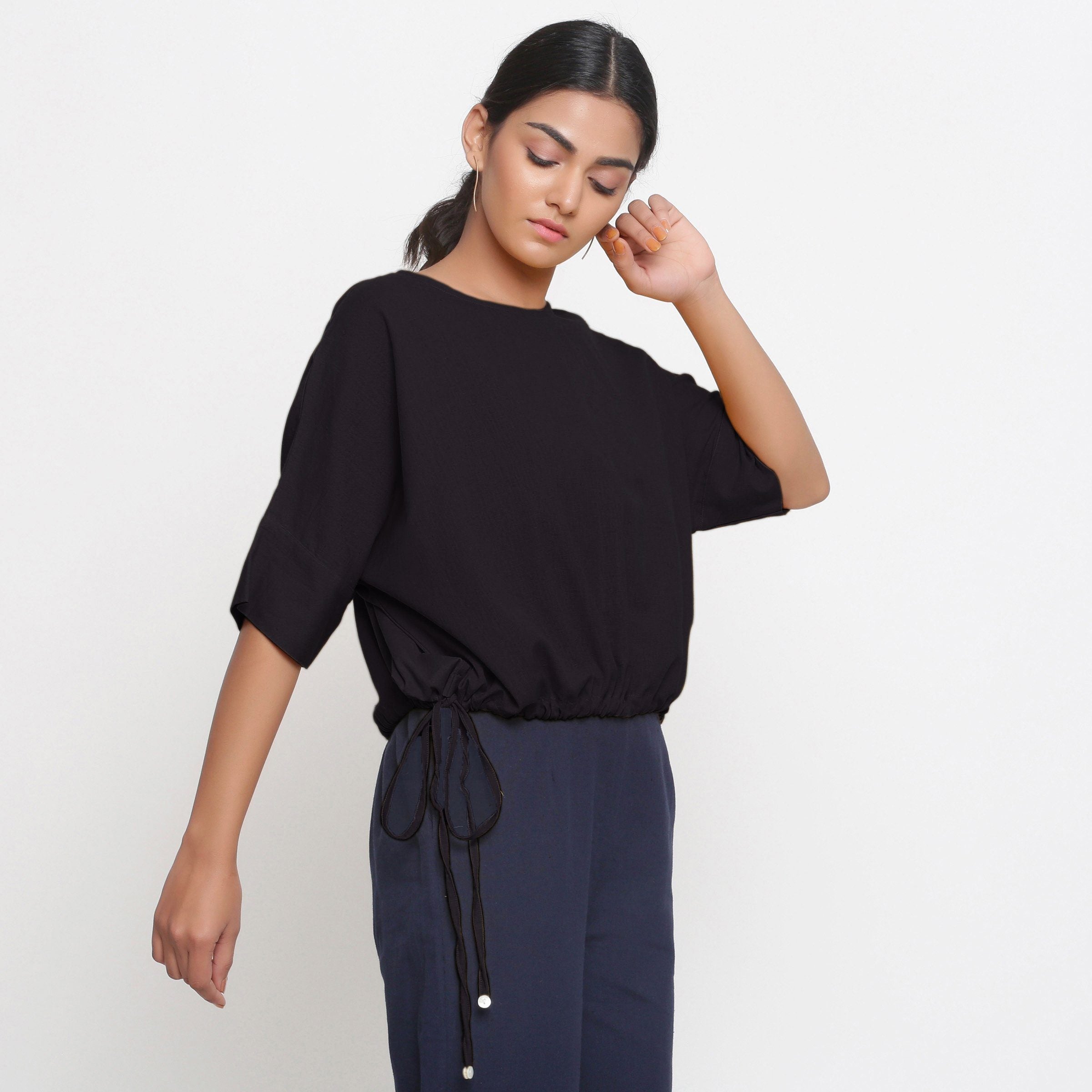 Back View of a Model wearing Solid Black Cotton Flax Blouson Top