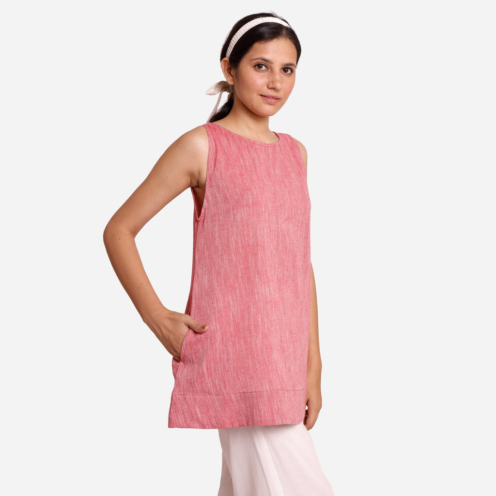 Right View of a Model wearing Brick Red Cotton Sleeveless Mini Tunic Dress