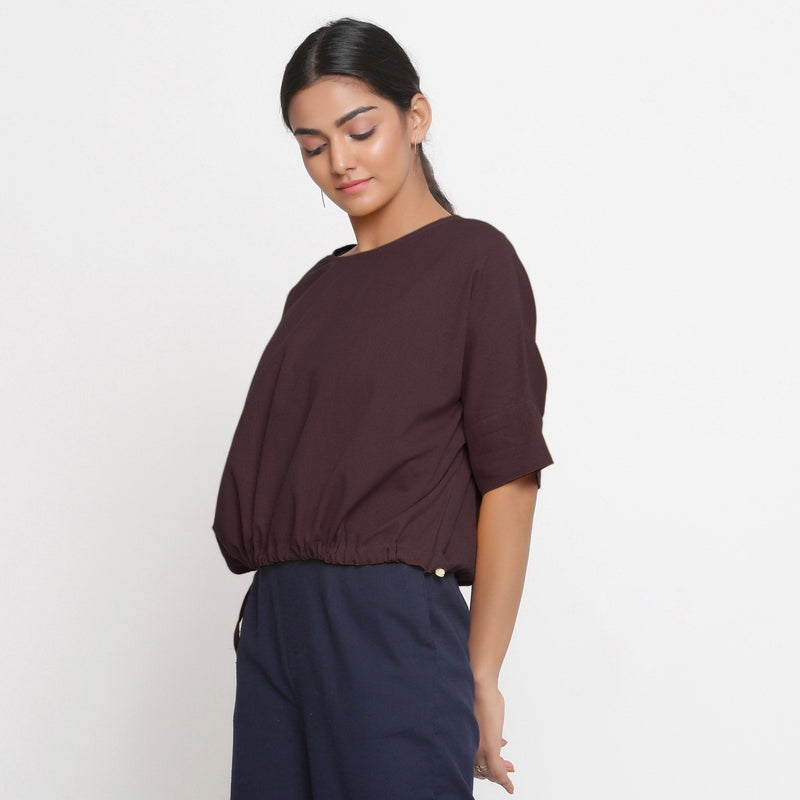 Left View of a Model wearing Solid Brown Cotton Flax Blouson Top
