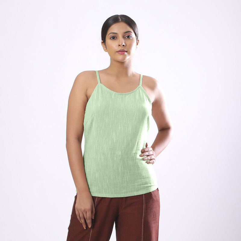 Front View of a Model wearing Solid Green Basic Cotton Spaghetti Top