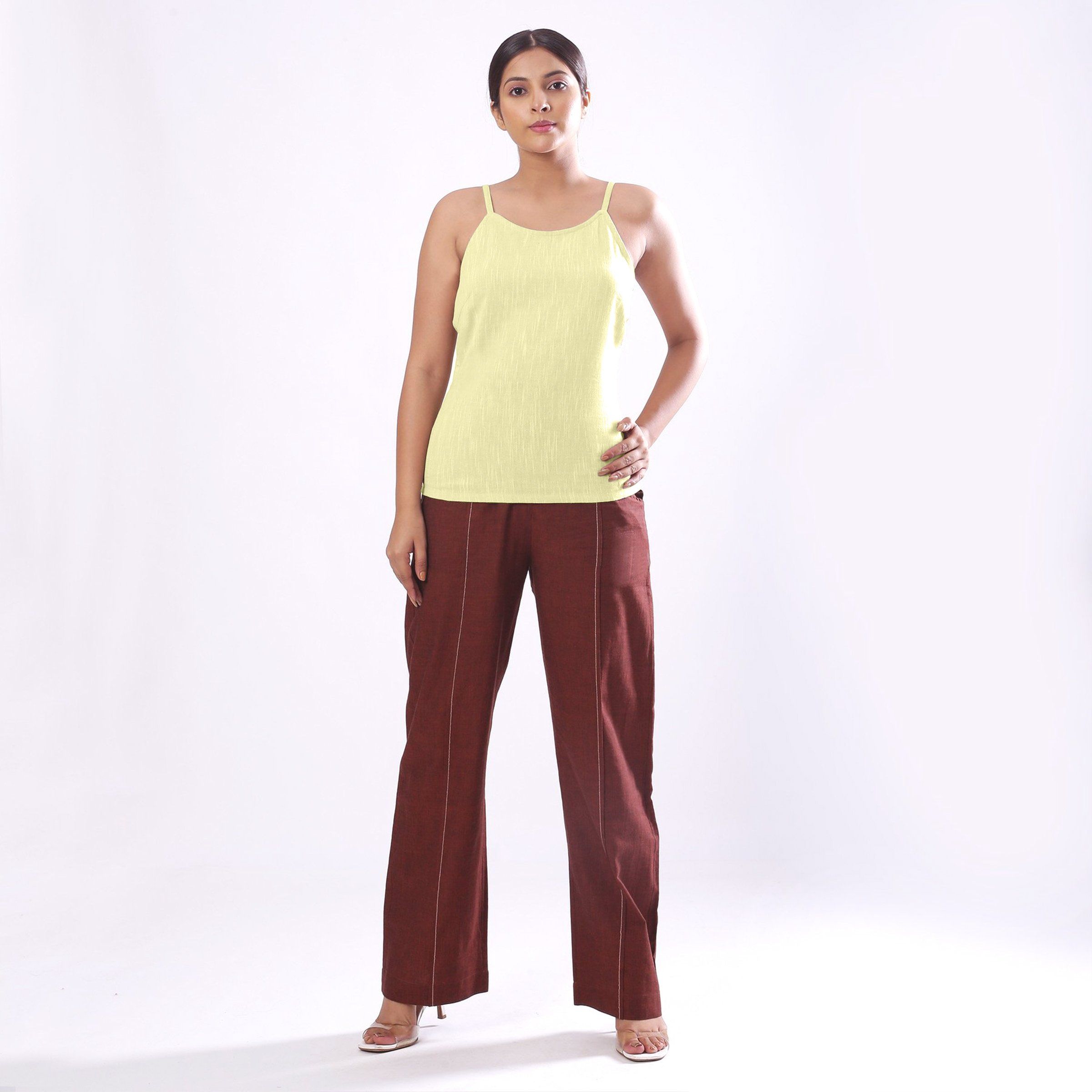 Front View of a Model wearing Solid Lemon Yellow Basic Cotton Spaghetti Top