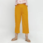 Front View of a Model wearing Solid Yellow Cotton Flax Culottes
