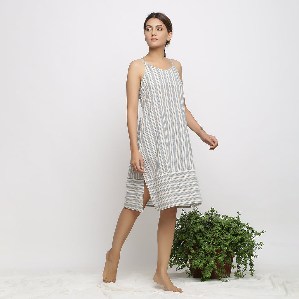 Right View of a Model wearing Strappy Handspun Striped Shift Dress