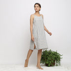 Right View of a Model wearing Strappy Handspun Striped Shift Dress