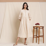 Front View of a Model wearing Dusk Beige Warm Cotton Striped Gathered Midi Dress