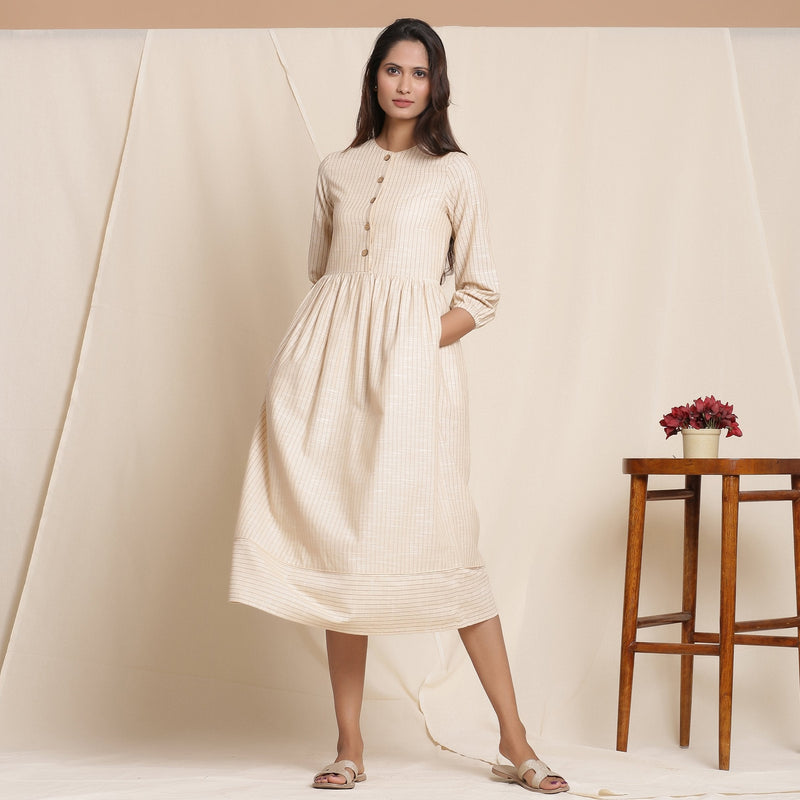 Front View of a Model wearing Dusk Beige Warm Cotton Striped Gathered Midi Dress