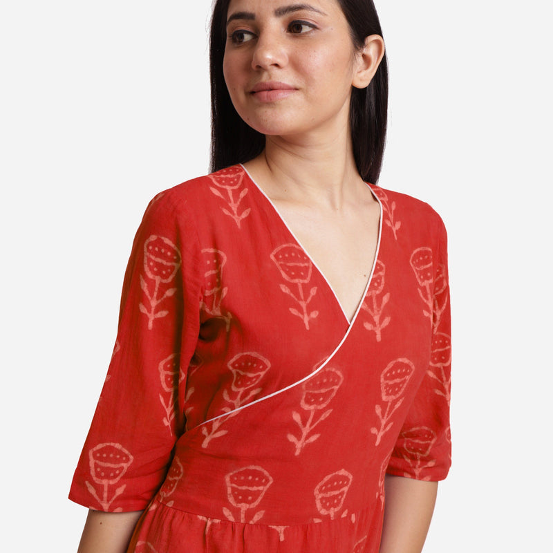 Front Detail of a Model wearing Sunset Orange Dabu Print 100% Cotton Wrap Dress