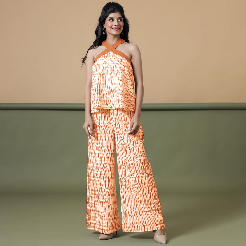 Front View of a Model wearing Sunset Orange Shibori Wide Legged Pant