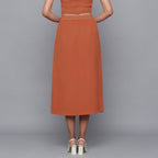 Back View of a Model wearing Sunset Rust Button-Down Midi Skirt