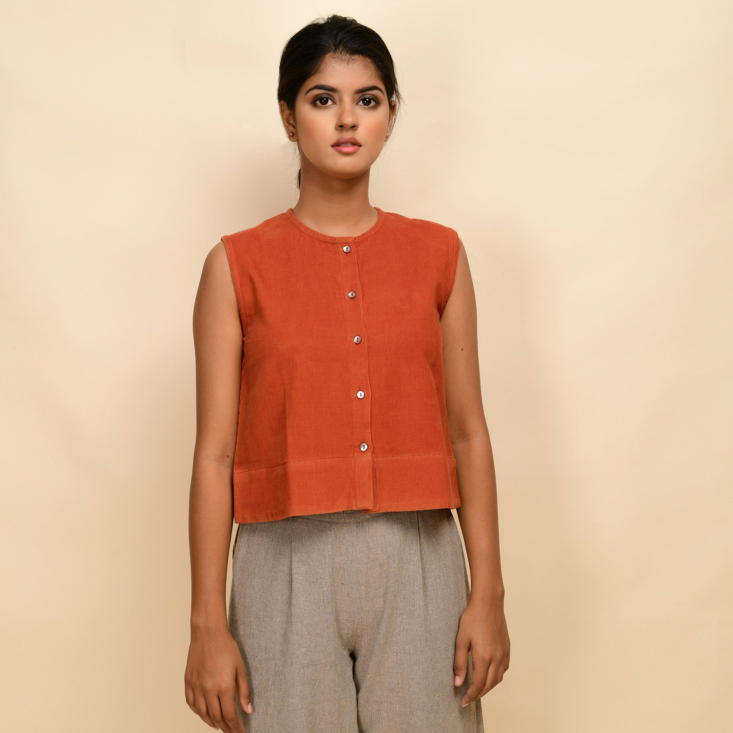 Front View of a Model wearing Sunset Rust Warm Cotton Corduroy Button-Down Short Top