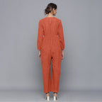Back View of a Model wearing Sunset Rust Corduroy Comfy Jumpsuit