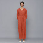 Front View of a Model wearing Sunset Rust Corduroy Comfy Jumpsuit