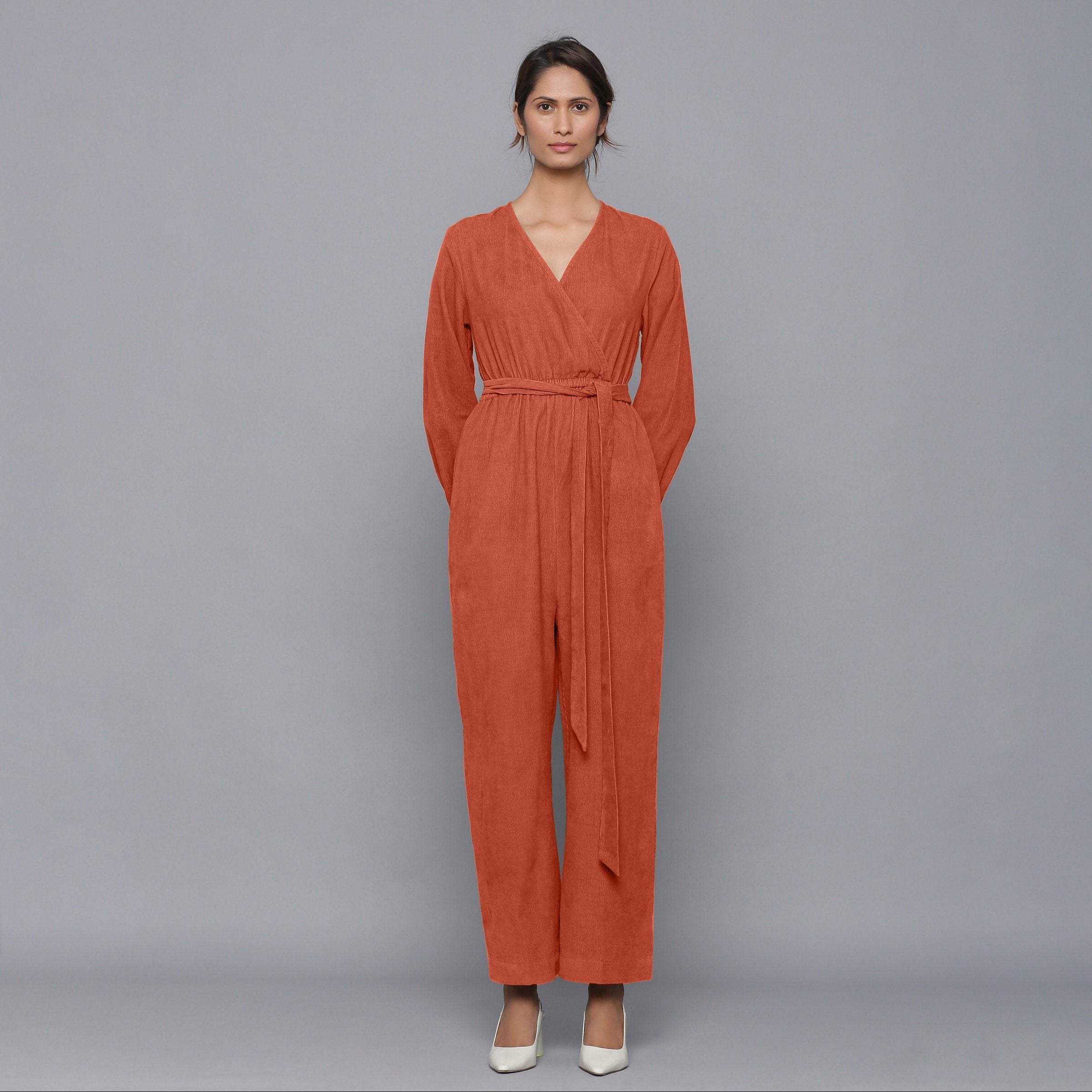 Front View of a Model wearing Sunset Rust Corduroy Comfy Jumpsuit