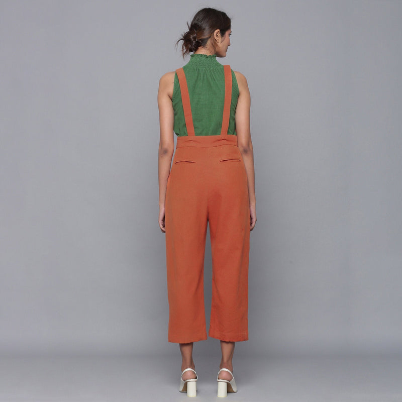 Back View of a Model wearing Sunset Rust Cotton Corduroy Dungaree
