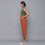 Left View of a Model wearing Sunset Rust Cotton Corduroy Dungaree