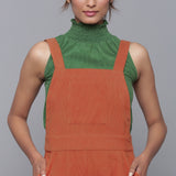 Front Detail of a Model wearing Sunset Rust Cotton Corduroy Dungaree