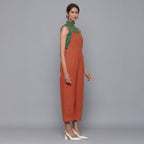 Right View of a Model wearing Sunset Rust Cotton Corduroy Dungaree