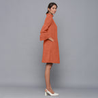 Right View of a Model wearing Sunset Rust Corduroy High Neck Dress