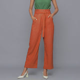 Front View of a Model wearing Sunset Rust Cotton Corduroy Pant